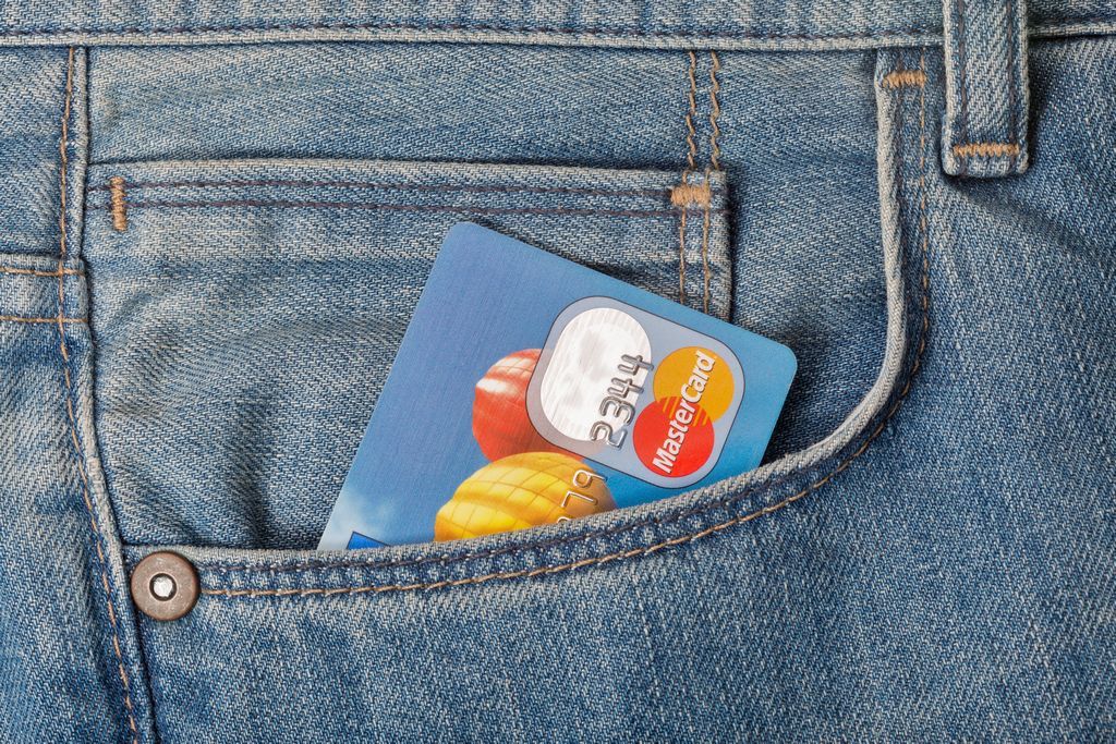 Mastercard 2-series card sticking out of a person's blue jean pocket